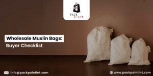 Alt text: "Three white muslin bags of varying sizes against a brown background. Text reads 'Wholesale Muslin Bags: Buyer Checklist' with contact details and logo."