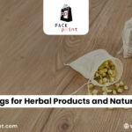 Muslin Bags for Herbal Products and Natural Brands Muslin bags filled with dried herbs and flowers are displayed on a wooden surface. Text overlay reads "Muslin Bags for Herbal Products and Natural Brands."